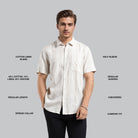 Man wearing a white checkered shirt with text describing fabric blend, sleeve length, and other features on a gray background