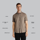 Man wearing a brown short-sleeve shirt with text labels on a gray background