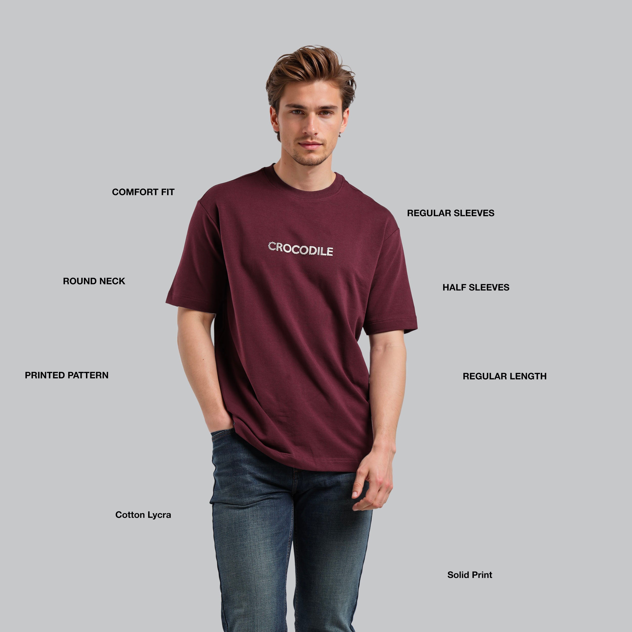 Man wearing a maroon t-shirt with 'Crocodile' branding on a gray background