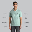 Man wearing a green patterned polo shirt with text describing features on a gray background