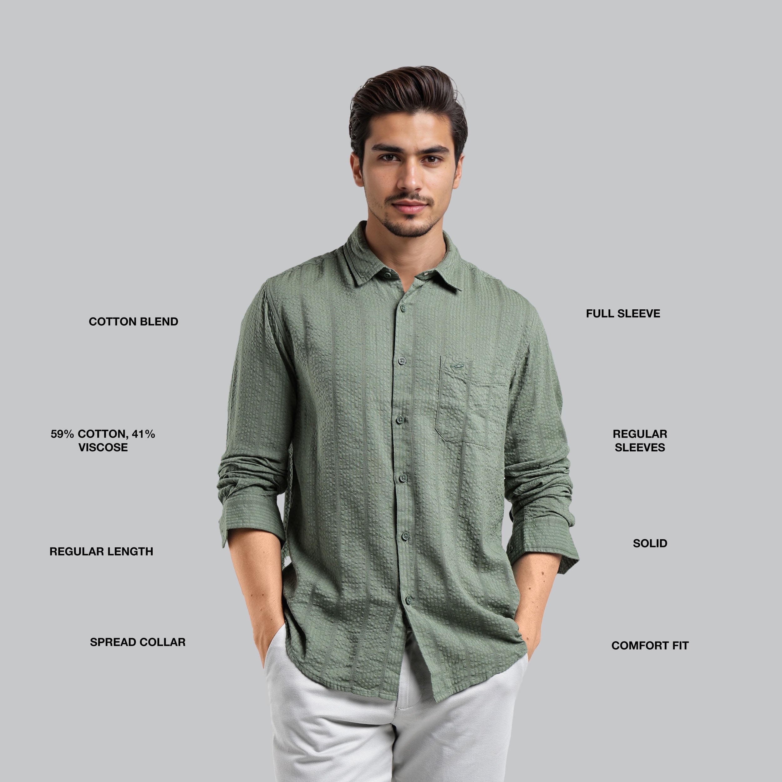 Man wearing a green shirt with text detailing fabric blend, sleeve length, and other features on a gray background