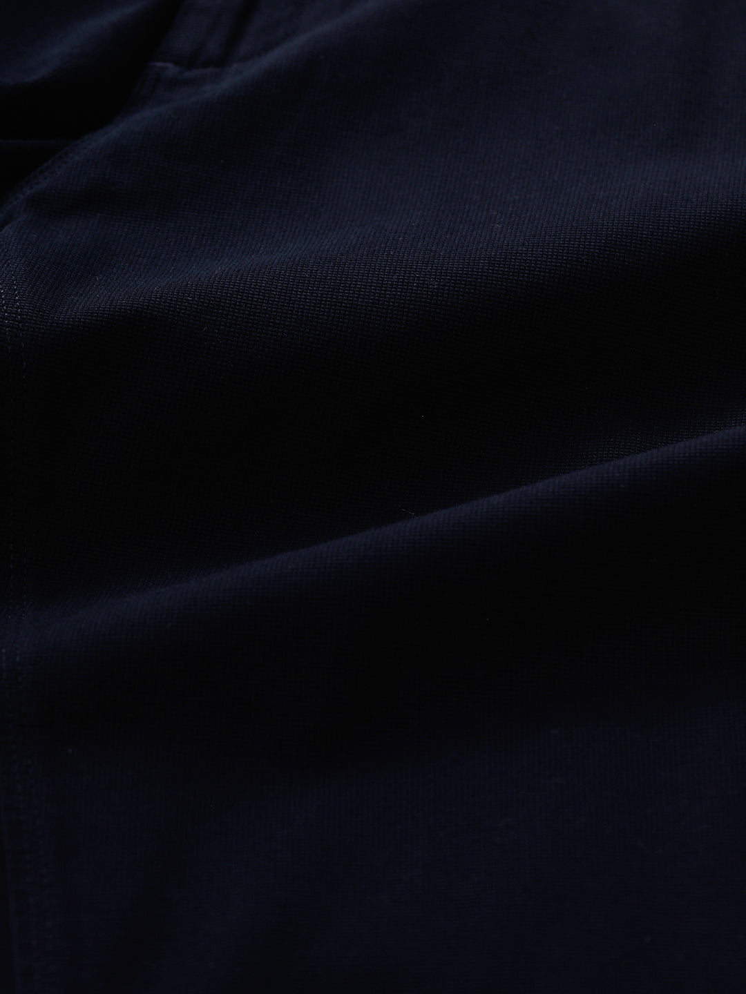 Man wearing a red textured essential chinos navy with casual styling on a gray background