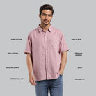 Man wearing a pink short-sleeve shirt with text describing features on a gray background