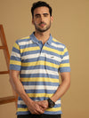 Man wearing a blue yellow blue striped polo t shirt with casual styling on a gray background