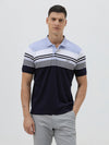 A man wearing a short-sleeve polo shirt with horizontal stripes in light blue, white, and navy, paired with light gray trousers, against a plain light gray background.