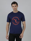 Man wearing a blue typography printed blue single jersey cotton t shirt on a light gray background