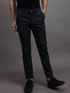 Man wearing a navy dark navy solid casual trouser with casual styling on a gray background