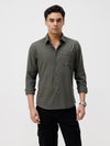 Man wearing a olive melange shirt olive on a light gray background