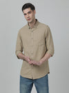 Man wearing a brown khaki brown checked casual full sleeve 100% cotton shirt with casual styling on a gray background