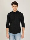 Man wearing a black black printed full sleeve 100% cotton casual shirt with casual styling on a gray background