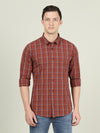 Man wearing a red brick red checked full sleeve 100% cotton casual shirt on a light gray background