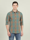 Man wearing a green casual green checked full sleeve 100% cotton shirt on a light gray background