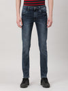Man wearing a blue light blue solid mid rise slim tapered jean on a light gray background