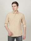 Man wearing a yellow solid full sleeve 100% cotton shirt light yellow with casual styling on a gray background