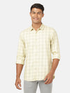 Man wearing a yellow yellow checked full sleeve 100% cotton casual shirt on a light gray background