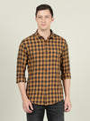 Man wearing a yellow mustard yellow checked full sleeve 100% cotton casual shirt on a light gray background