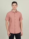 Man wearing a red light red checked half sleeve 100% cotton shirt with casual styling on a gray background