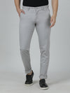 Man wearing a grey grey casual solid trouser with casual styling on a gray background