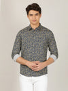 Man wearing a navy navy printed full sleeve 100% cotton casual shirt with casual styling on a gray background