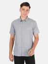 Man wearing a grey light grey checked half sleeve shirt on a light gray background
