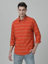 Man wearing a orange striped full sleeve 100% cotton casual shirt on a light gray background