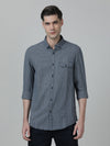 Man wearing a navy checked navy full sleeve 100% cotton casual shirt on a light gray background