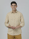 Man wearing a beige beige printed full sleeve shirt with casual styling on a gray background