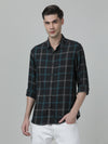 Man wearing a black casual black checked full sleeve 100% cotton shirt with casual styling on a gray background