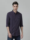 Man wearing a red wine red checked casual full sleeve 100% cotton shirt with casual styling on a gray background